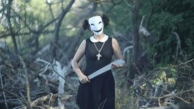 Masked schoolgirl with knife in pine forest on autumn tree - Powered by Shutterstock - Get 15% off with code: PIKWIZARD15