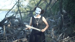 Masked schoolgirl with knife in pine forest on autumn tree - Powered by Shutterstock - Get 15% off with code: PIKWIZARD15