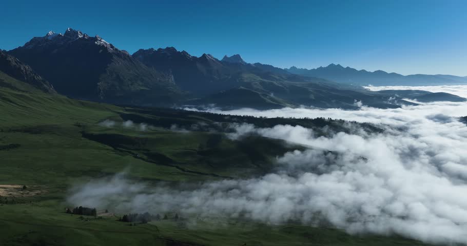 Aerial footage of beautiful high altitude snow capped mountains landscape in sichuan, China