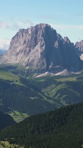 Vertical screen Dolomites mountain panorama with valleys and alpine slopes in Italy