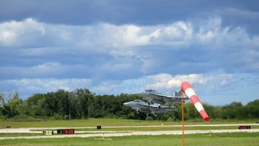 Slow motion view of two F-18 fighter jets taking off into the bright sky, showcasing military strength, speed, and precision. - Powered by Shutterstock - Get 15% off with code: PIKWIZARD15