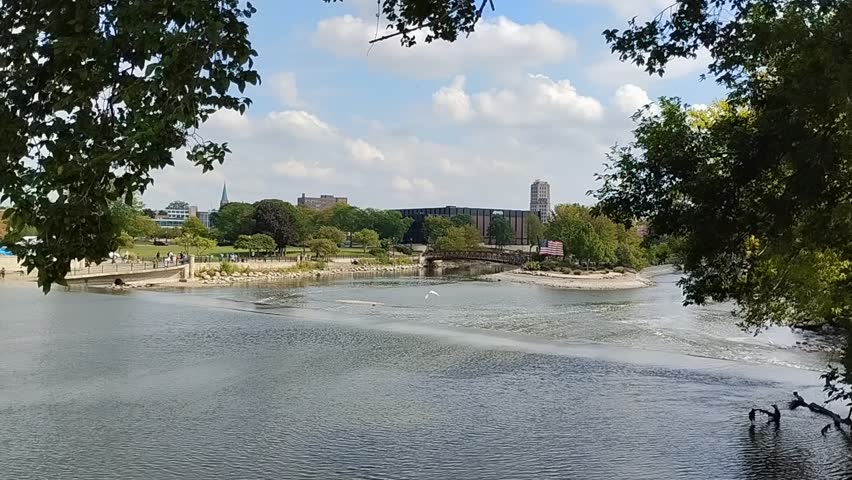 Elgin, Illinois, USA - September 21, 2025: Fox River with view of downtown Elgin, Illinois