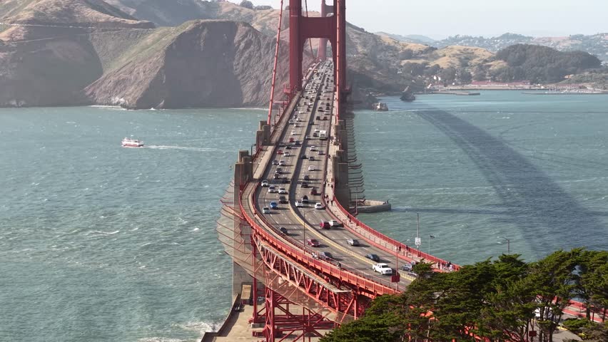 Golden Gate Bridge Traffic on Sunny Day, San Francisco USA, Revealing Drone Shot