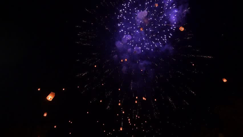 Sky lanterns with fireworks show in Loy Krathong Festival or Yi Peng Festival at Chiang Mai Thailand. The old traditions and culture of Thailand