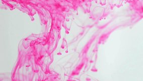 Vibrant pink ink elegantly drips and swirls through clear water, creating beautiful, abstract, smoke-like clouds and patterns against a clean, white background. - Powered by Shutterstock - Get 15% off with code: PIKWIZARD15