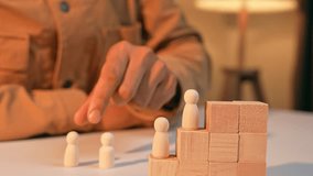 An HR places male and female wooden figures on the same level, symbolizing gender equality in society and the workplace, as well as fair opportunities and inclusive leadership for all individuals.
 - Powered by Shutterstock - Get 15% off with code: PIKWIZARD15