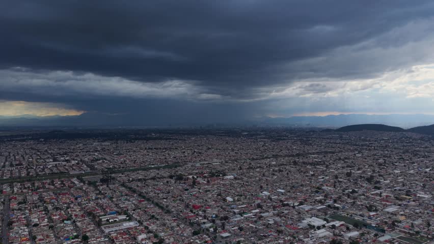 Aerial footage of Ecatepec, Mexico, showing densely populated areas and demographic growth