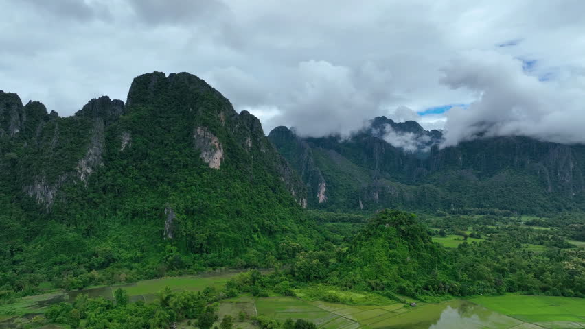 Aerial view of lush rice fields and mountains in Vang vieng, Laos.