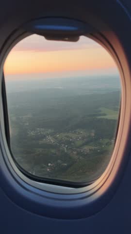 View from airplane window showing clouds and sky during flight. Perfect for travel, vacation, business trip, wanderlust, and aviation-themed projects.