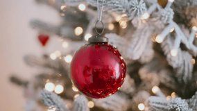 Christmas ornament red glass bauble glitter frost, pine branches lights, holiday decoration detail, New Year celebration mood, cozy festive atmosphere, sparkling winter background, seasonal spirit. - Powered by Shutterstock - Get 15% off with code: PIKWIZARD15