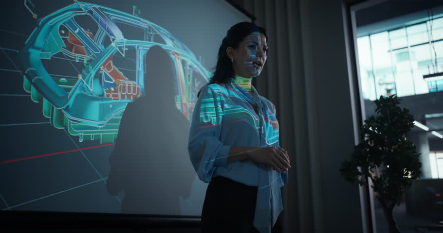 Female Automotive Engineer Delivers a Keynote on Modern Electric Vehicle Manufacturing, Showing Visuals of Car Chassis, Blueprints and Production Processes on a Big Screen in Meeting Room