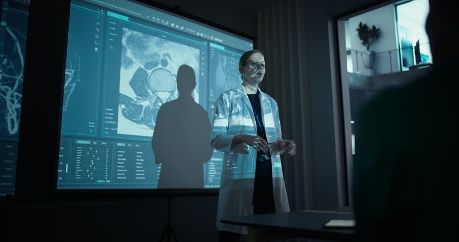 Professional Female Scientist Delivers a Keynote on Medical and Healthcare Innovations, Showing Anatomy Slides with Hospital Data, Patient Diagnostics and Scientific Graphics