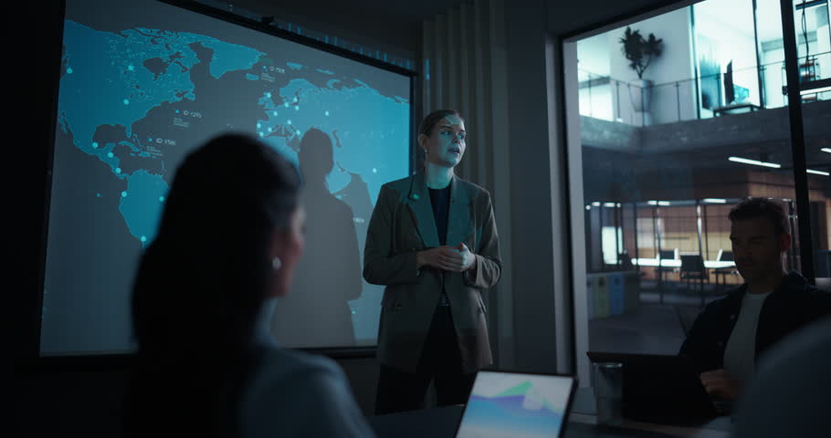 Confident Businesswoman Holds a Meeting, Giving a Presentation on Global Logistics and Shipping Innovations. Her Keynote Highlights Modern Transportation Technology and Network Solutions