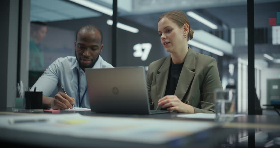 Excited Managers Having a Brainstorming Session in an Office Meeting Room. African Male and Caucasian Female Colleagues Make a High Five After Coming Up with a Great Idea for the Business