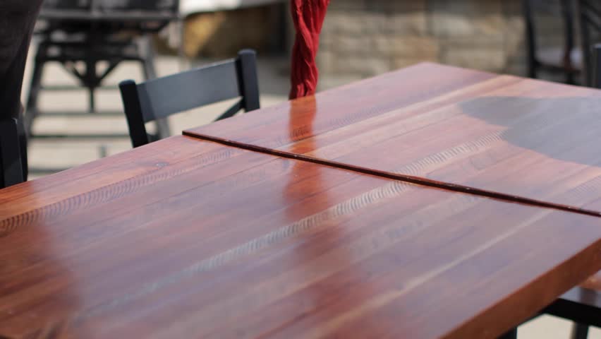 Planner decorating a table for an outdoor dinner.
