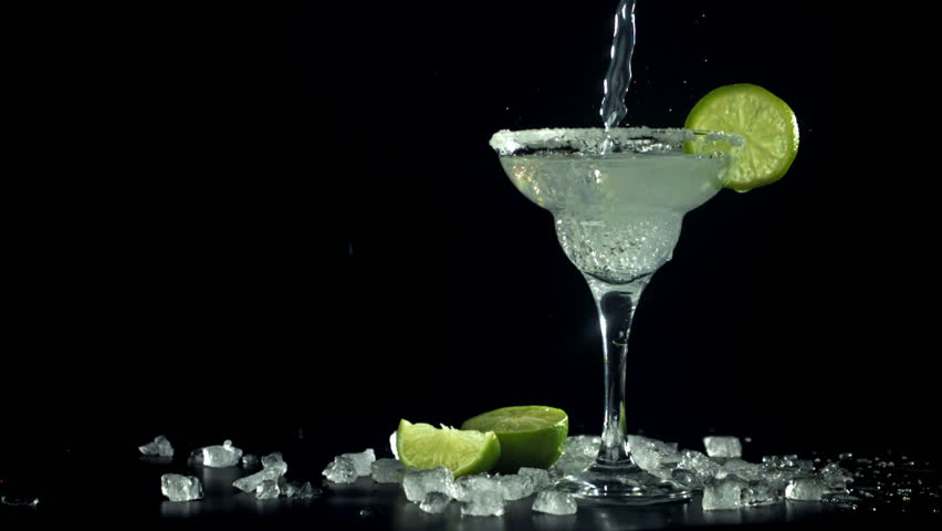 A margarita cocktail is poured into a glass. Filmed on a high-speed camera at 1000 fps. High quality FullHD footage