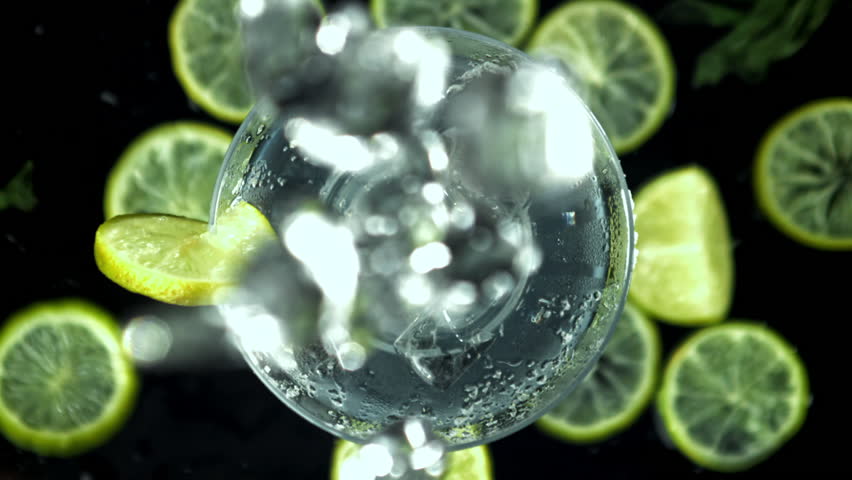 Ice falls into a margarita cocktail. Filmed on a high-speed camera at 1000 fps. High quality FullHD footage