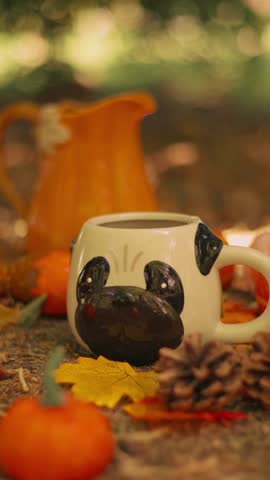 Cute Teacups on an Autumn Setting Outdoors