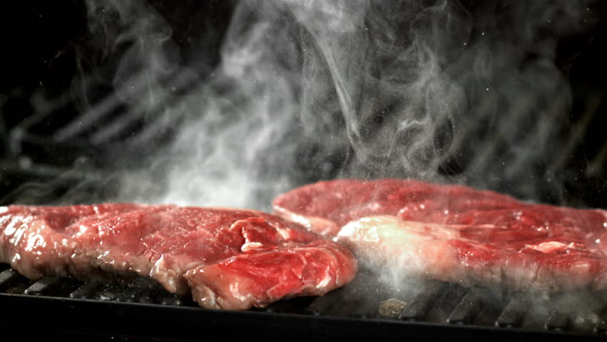 Beef ribeye steak is grilled. Filmed on a high-speed camera at 1000 fps. High quality FullHD footage