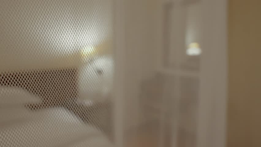 Close up on mosquito net canopy inside luxury hotel room or suite in Africa. Protection againstbugs insects and mosquito bites at night. Disease prevention while sleeping in mosquito population areas