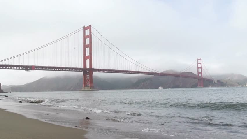 The iconic golden gate bridge stands tall amidst a foggy san francisco bay
