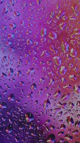 Rain-splattered windowpane with water droplets gently sliding in dim evening light, moody soft focus, ambient atmosphere, soothing scene, perfect for cinematic, introspective, melancholic visuals.