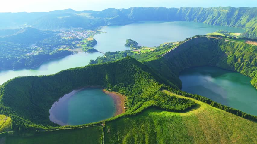 Sete Cidades Lagoon at Sunset. Blue Lake, Green Lake, Rasa Lake and Santiago Lake. Green Fields and Hills. Azores, Sao Miguel Island. Portugal. Aerial View. Drone Moves Sideways