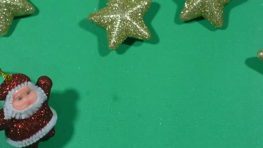 Green Christmas background with fir branches and decorations.