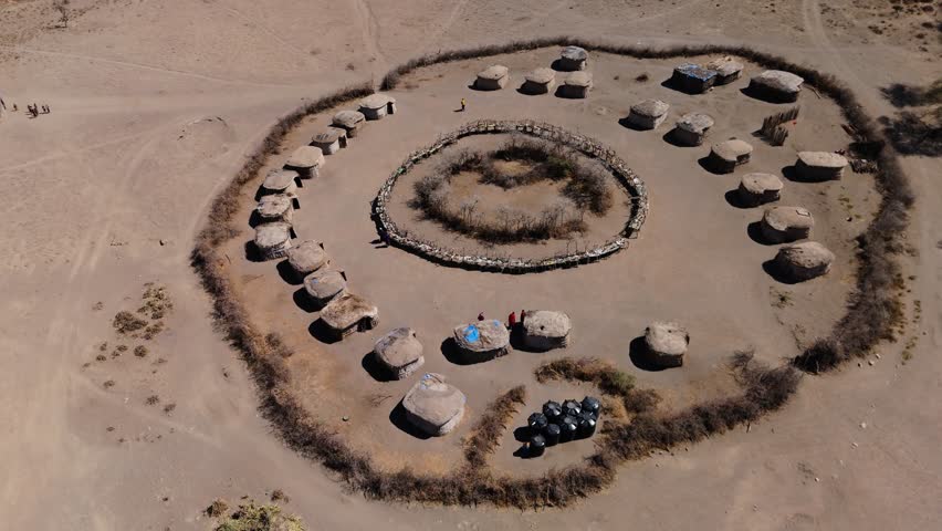 city scape view of rural settlement of masai. DRONE SHOT OF MASAI VILLAGE NGORONGORO
