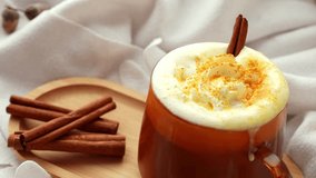 Autumn hygge Orange Cup of warm coffee autumn leaves on table against raindrops are running down the glass in window. Cozy fall still life footage burning candles. Thanksgiving and Halloween holiday - Powered by Shutterstock - Get 15% off with code: PIKWIZARD15