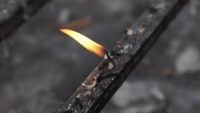 Close-up of candle wick burning down to the end, small fading flame on melted wax, symbol of time, transience, and the end of light. - Powered by Shutterstock - Get 15% off with code: PIKWIZARD15