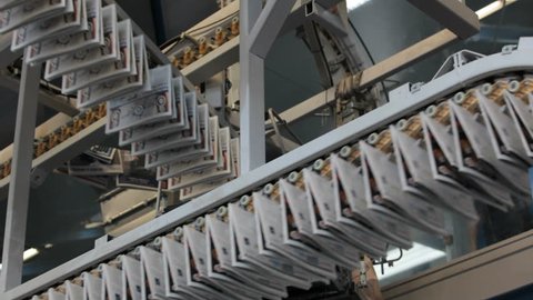 production lines crossing in newspaper printing press