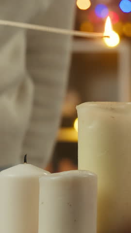 Woman decorating christmas tree. Young female student hanging balls and toys on evergreen tree in living room. Winter holidays concept, present box. Celebrating new year at home. 