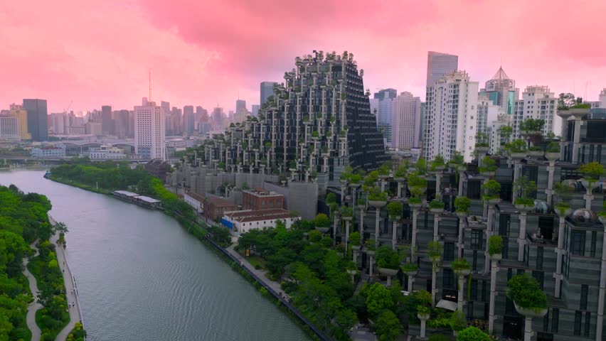 Shanghai, China - 15 august 2025: Aerial view of the '1000 Trees' building and a river with modern architecture and integrated plants.