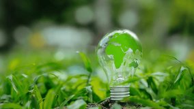 Light bulb with green map and green forest environment icon - environment esg concept, ecology and sustainable environment of the world. Eco-friendly green business. ecology, earth day, net zero - Powered by Shutterstock - Get 15% off with code: PIKWIZARD15