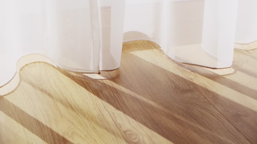 Transparent white curtain tulle moves from the wind from an open window with shadows. Sunny day, the sun's rays sunlight penetrate the room.