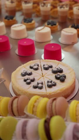 Dessert table with sweet pastries and mousse cakes. Concept of exquisite confectionery.