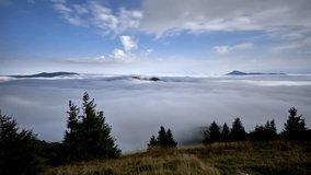 Moonlight Illuminating Clouds Over Misty Mountain Landscape in Night Timelapse - Powered by Shutterstock - Get 15% off with code: PIKWIZARD15