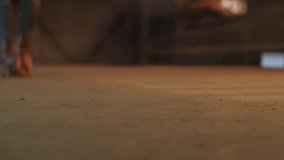 Roller skates roll away on semi-dark rink floor showing speed - Powered by Shutterstock - Get 15% off with code: PIKWIZARD15