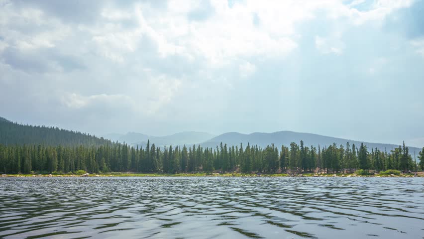 Timelapse over Echo Lake, Colorado, captures shifting skies, drifting clouds, and shimmering reflections against the Rocky Mountain backdrop, showcasing nature’s beauty in motion