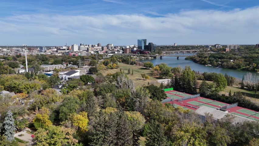 4K aerial view of King George in Saskatoon, showing homes, schools, parks, and its riverside location near the South Saskatchewan River.