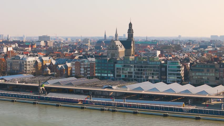 skyline antwerp belgium boats scheldt river historical buildings banks town above scenic urban area reveals from aerial drone shot view