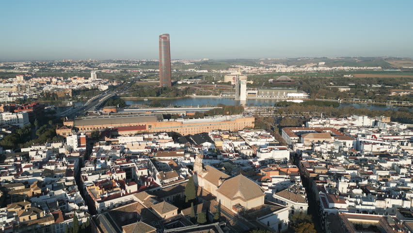 Captivating panorama of Seville, the most populous city in Andalusia province, Spain. Aerial view, descending footage.