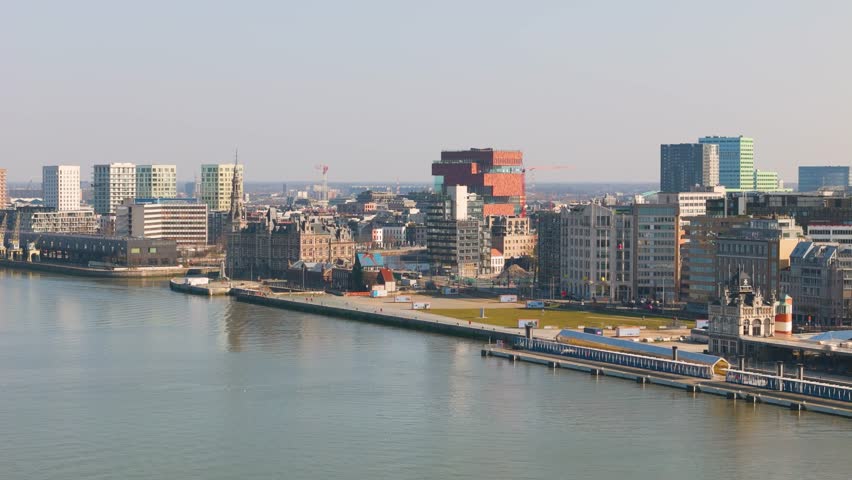 skyline antwerp belgium boats scheldt river historical buildings colorful prominent red building scenic urban area infrastructure aerial drone shot view