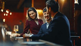 Partying people taking drinks bar counter closeup. Joyful business friends making toast raising glasses at night club. Positive colleagues enjoying meeting together indoor. Event celebration concept - Powered by Shutterstock - Get 15% off with code: PIKWIZARD15