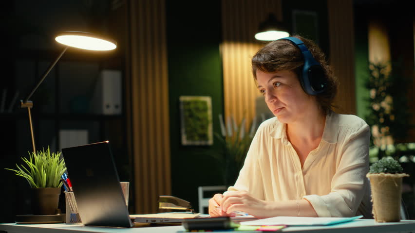 Business consultant summarizing important ideas in a meeting call with investors, extracting essential bullet points from the discussion with business associates. Insight in a briefing. Camera B.
