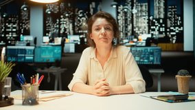 Businesswoman in the office engages in communication during virtual presentation, talking to participants about a productive collaboration. Person working late at night on a video call. Camera A. - Powered by Shutterstock - Get 15% off with code: PIKWIZARD15