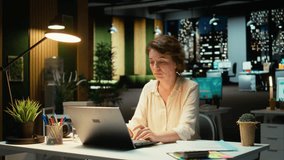 Female assistant engaging in a phone call after hours at the office, giving insight on financial data reports and other metrics for accounting. Chatting on a smartphone connection. Camera A. - Powered by Shutterstock - Get 15% off with code: PIKWIZARD15
