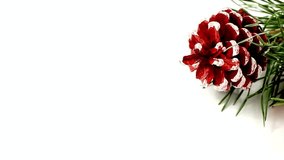 Red pine cone with white accents and green pine needles on a white background - Powered by Shutterstock - Get 15% off with code: PIKWIZARD15