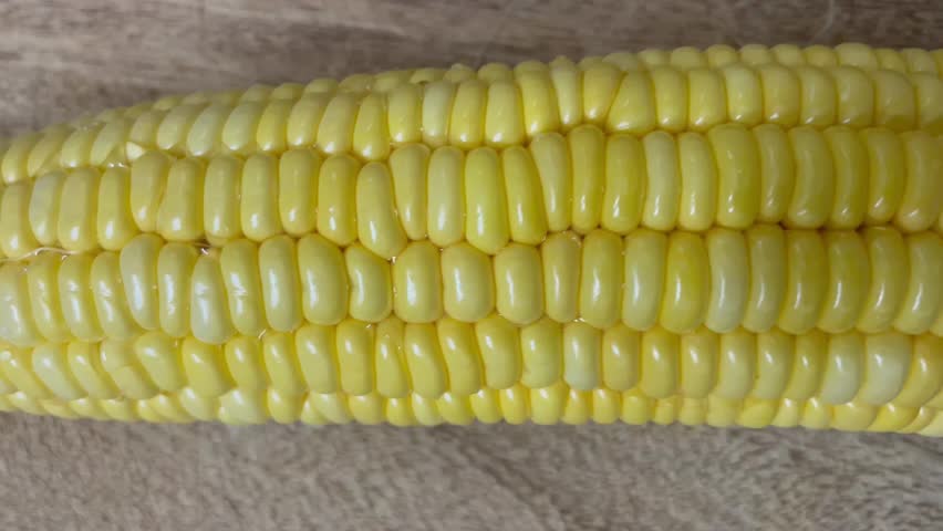 Fresh Yellow Corn on the Cob on Wooden Surface